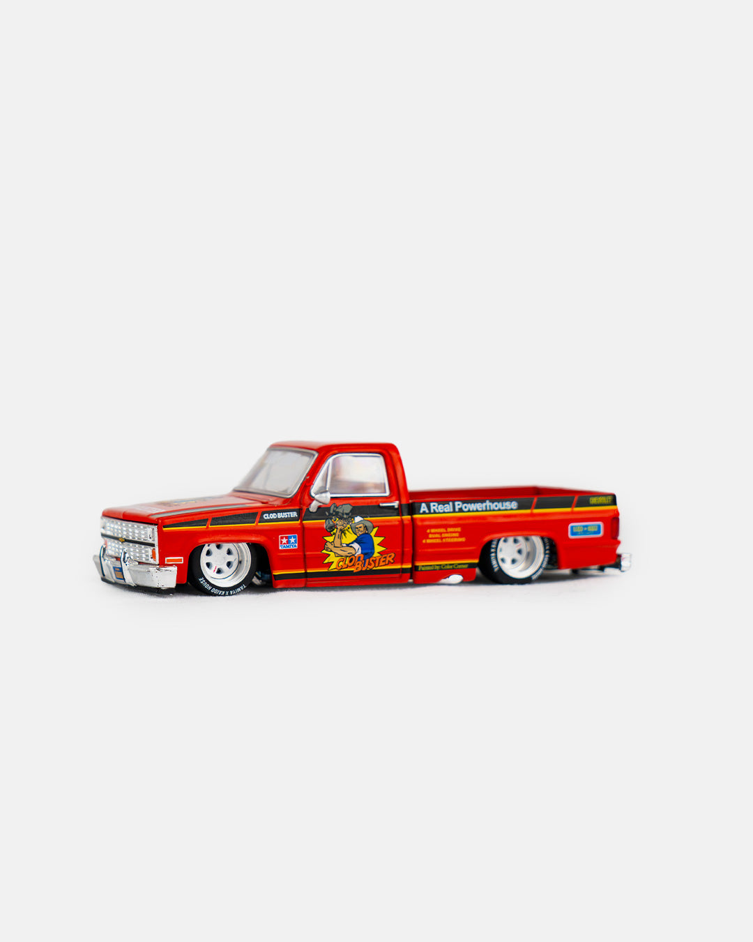 Kaido House x Mini GT 1:64 Chevrolet Silverado Tamiya x Kaido House “CLOD BUSTER” – Orange