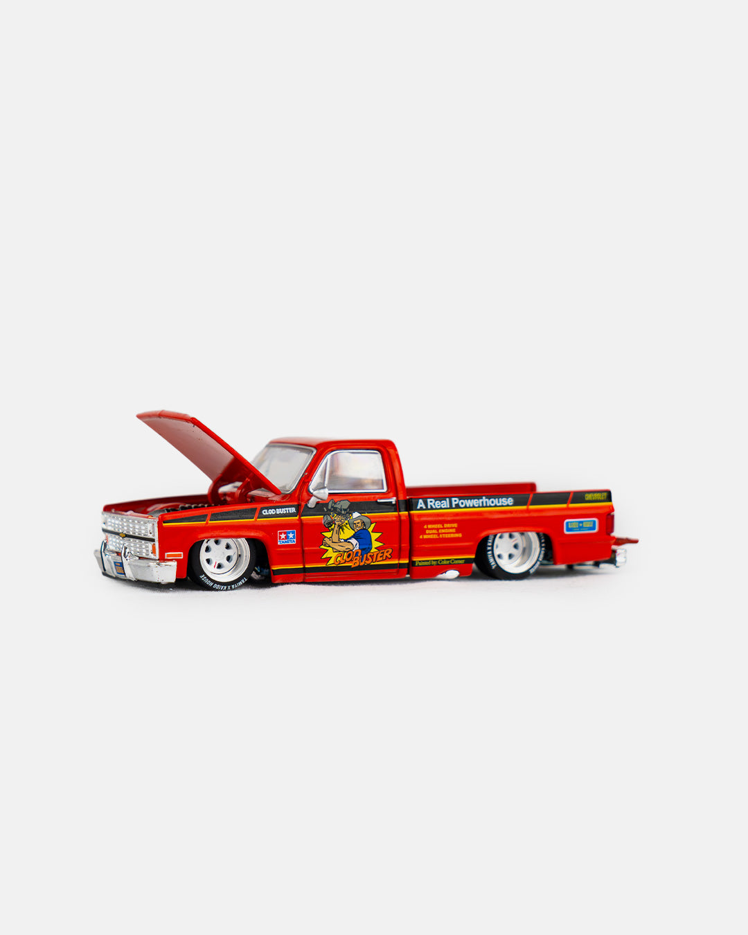 Kaido House x Mini GT 1:64 Chevrolet Silverado Tamiya x Kaido House “CLOD BUSTER” – Orange