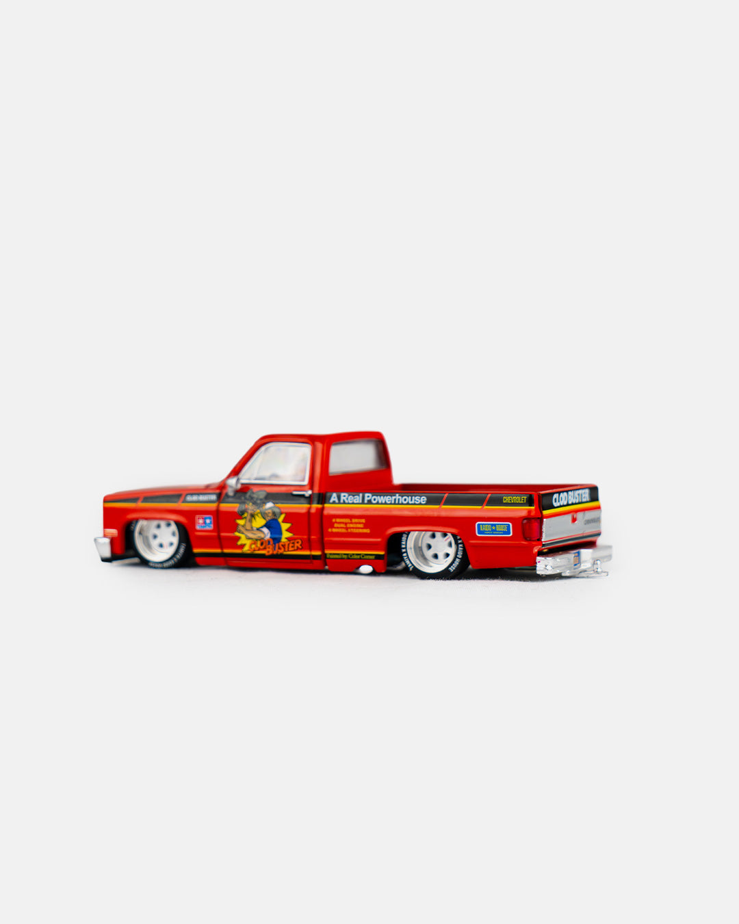 Kaido House x Mini GT 1:64 Chevrolet Silverado Tamiya x Kaido House “CLOD BUSTER” – Orange