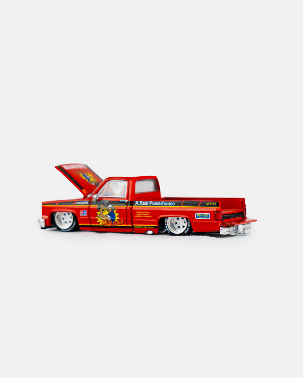 Kaido House x Mini GT 1:64 Chevrolet Silverado Tamiya x Kaido House “CLOD BUSTER” – Orange